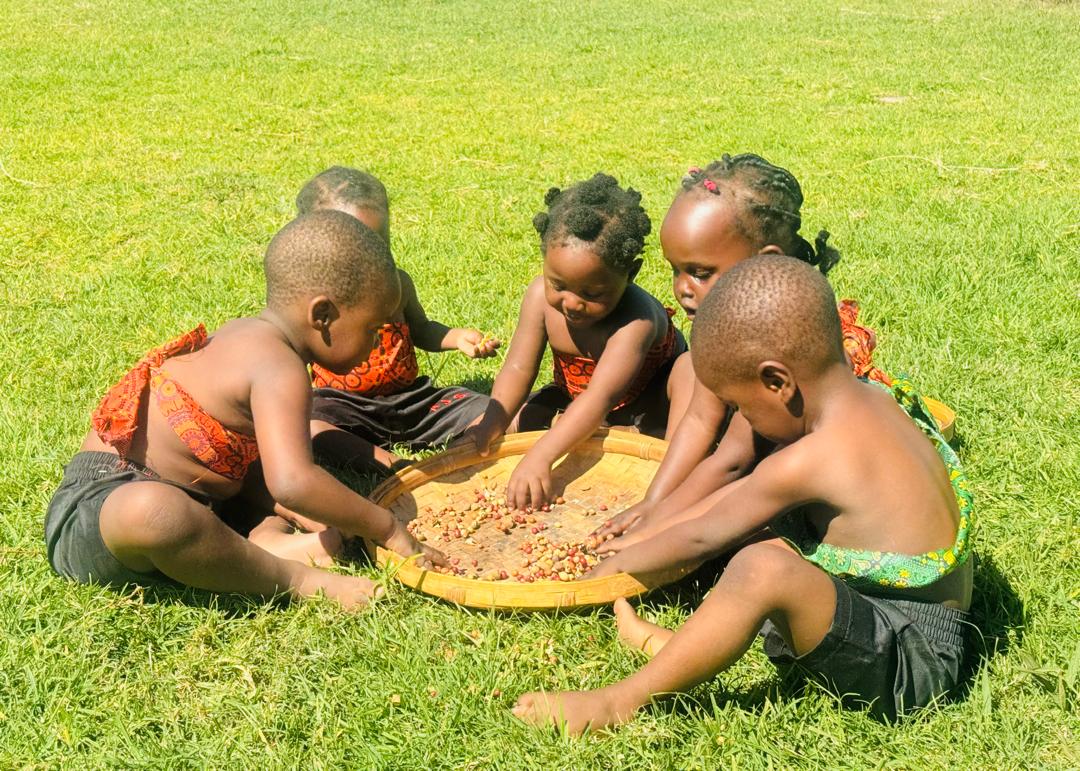 Students showcasing paintings in our creative arts department